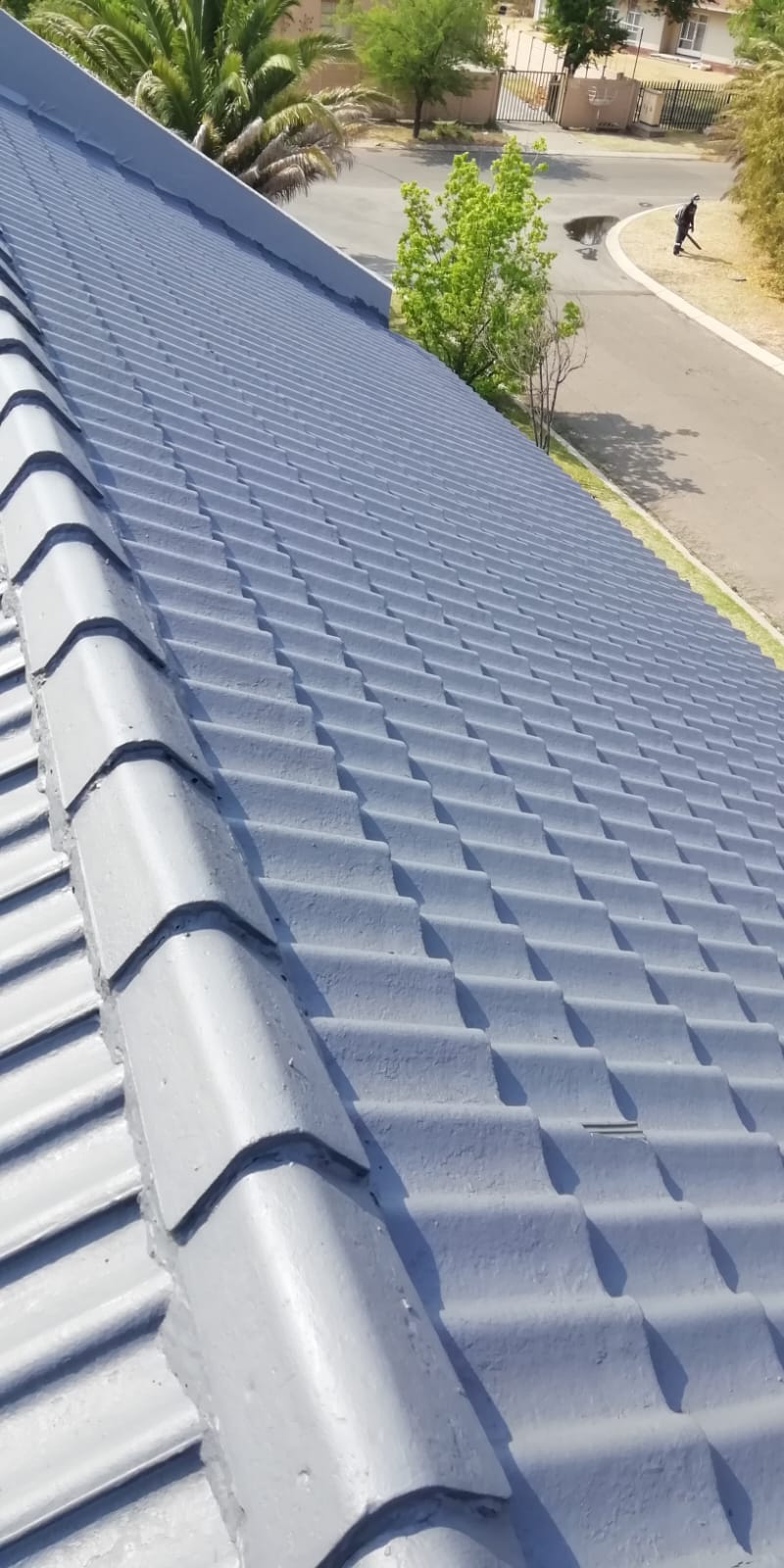 Tiled roof coated with fresh grey roof sealant
