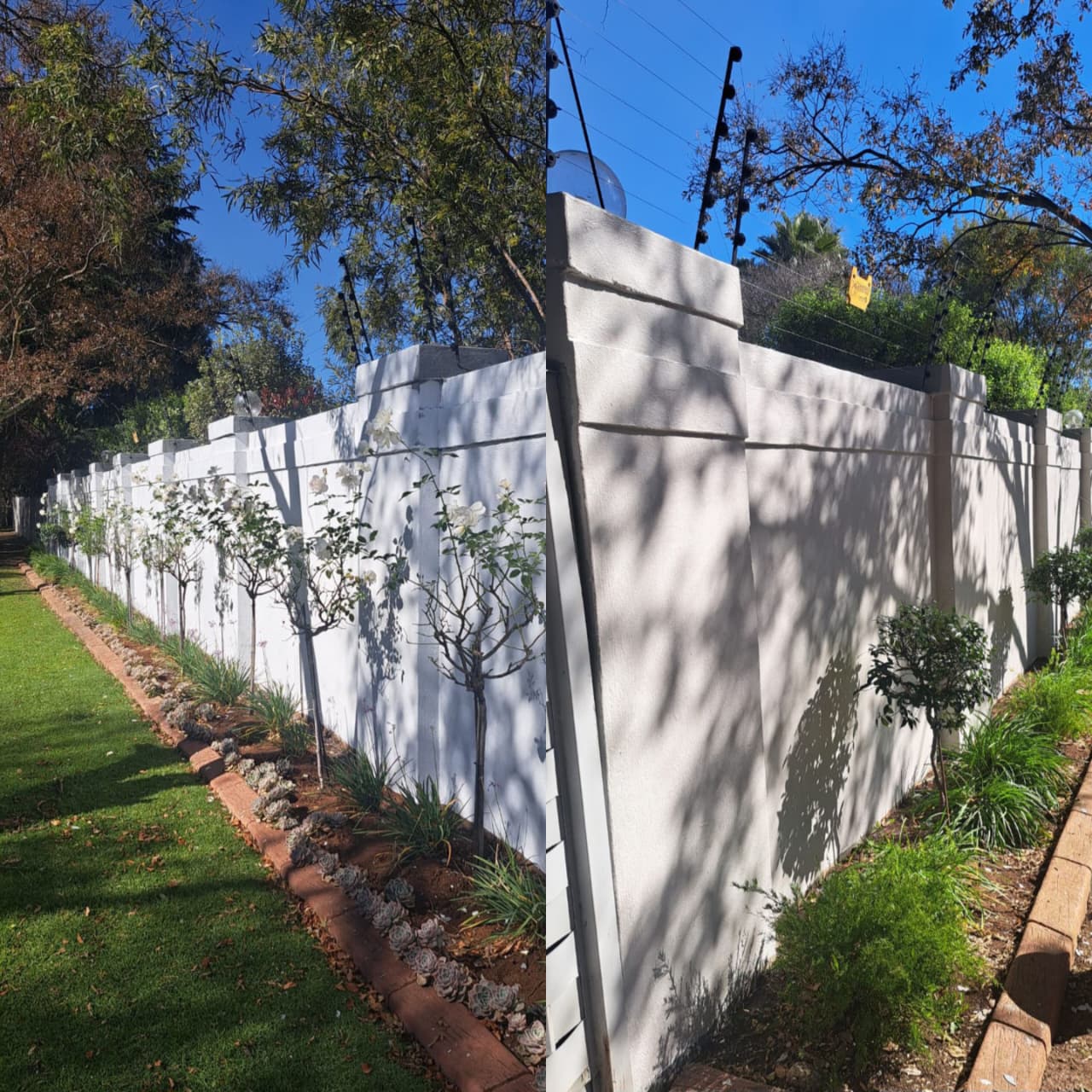 Freshly painted white boundary wall alongside a landscaped garden
